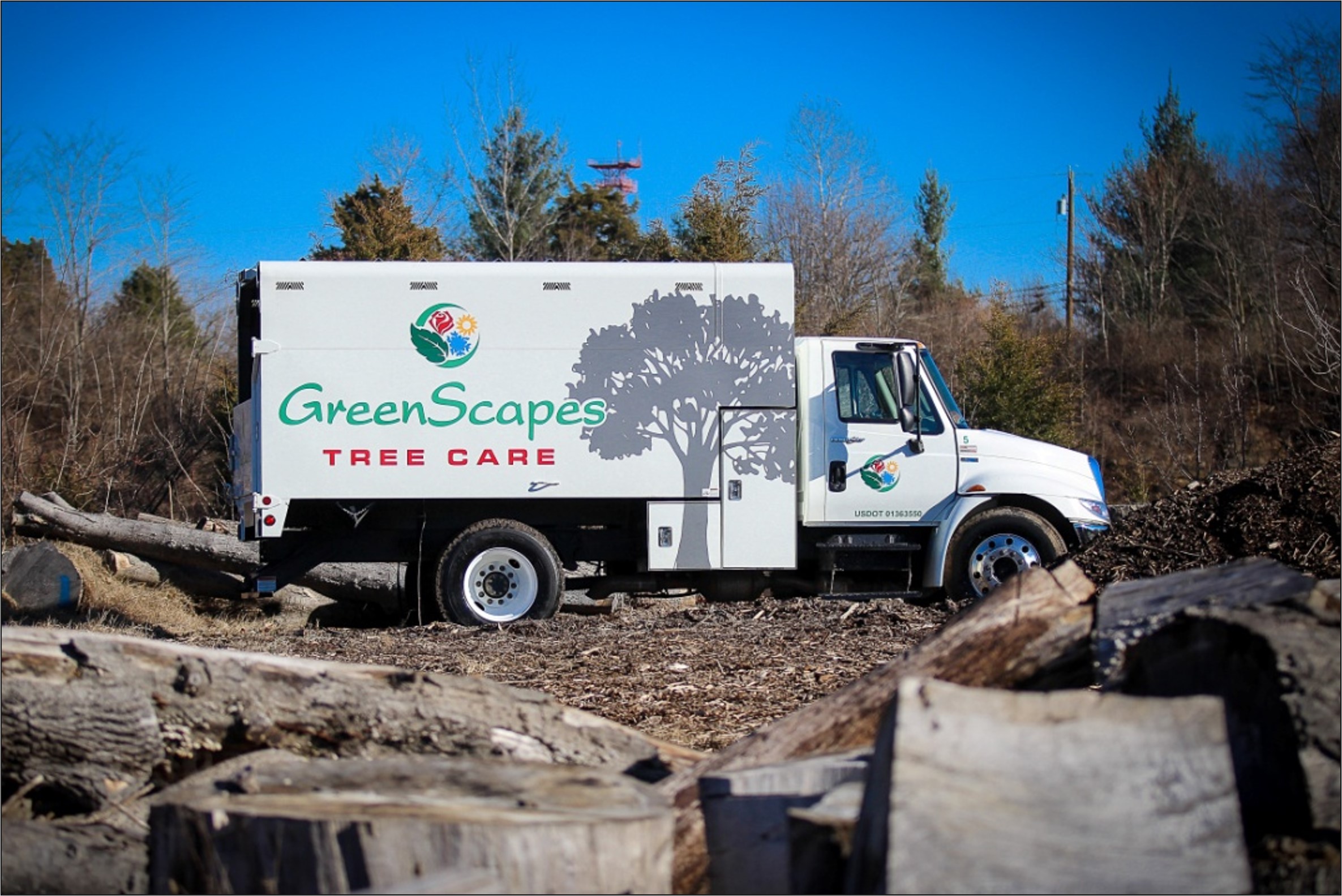 GreenScapes Tree care Truck in cleared field